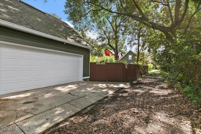 a backyard of a house with lots of green space