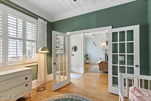 a spacious bedroom with a bed and a window