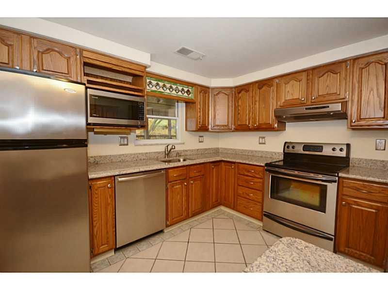 120 Foxcroft Road Pittsburgh, PA 15220 - Photo 2 of 25 Kitchen. Renovated Eat In Kitchen has granite counters/built in table and stainless steel appliances.