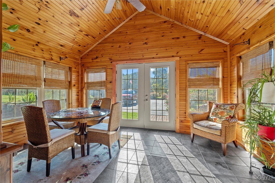 988 County Rte 14 Granby, NY 13069 - Photo 3 of 47 Sunroom-knotty pine walls/ceiling