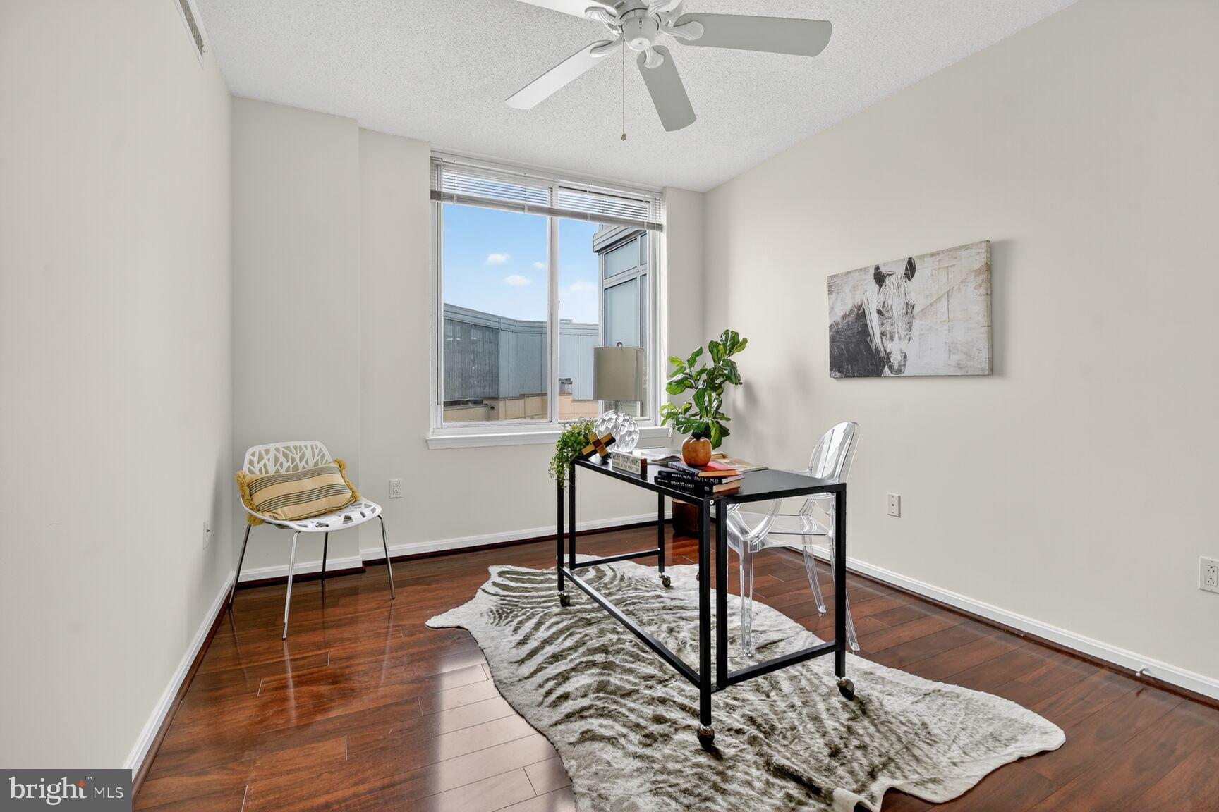 930 Wayne Avenue, Unit 1210 Silver Spring, MD 20910 - Photo 23 of 42 a workspace room with furniture and wooden floor