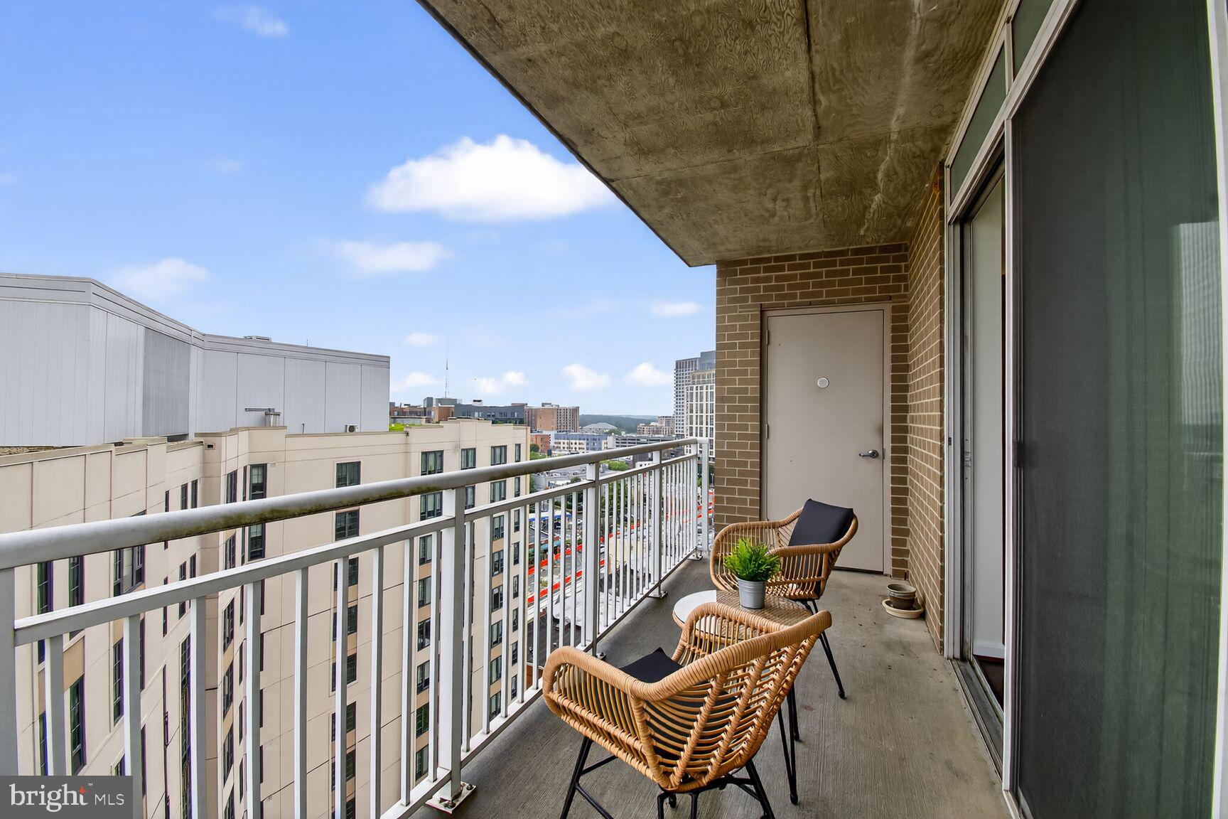 930 Wayne Avenue, Unit 1210 Silver Spring, MD 20910 - Photo 29 of 42 a view of a balcony with furniture