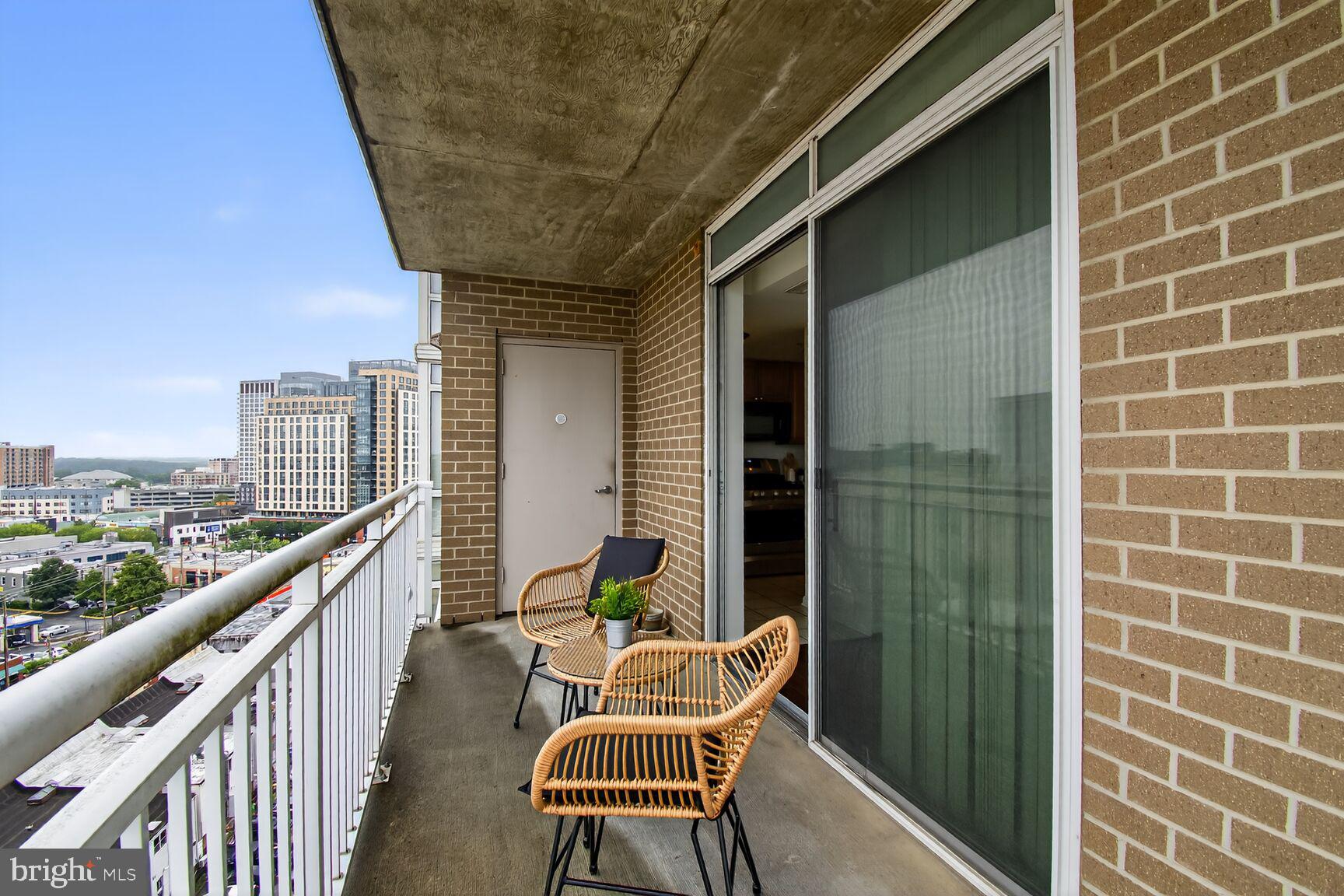 930 Wayne Avenue, Unit 1210 Silver Spring, MD 20910 - Photo 30 of 42 a balcony with couple of chairs