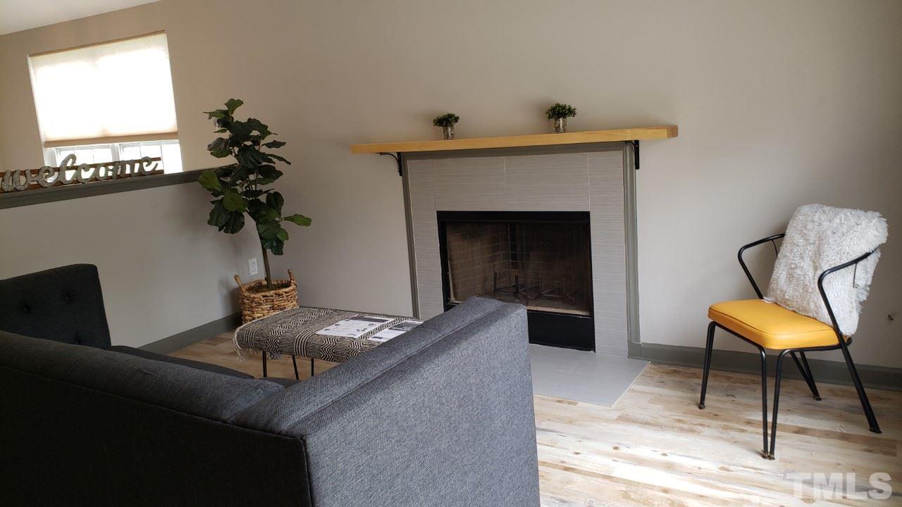 921 Roxy Street Raleigh, NC 27610 - Photo 3 of 12 a living room with furniture and a fireplace