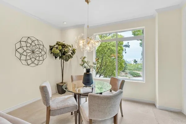 a view of a dining room with furniture window and outside view