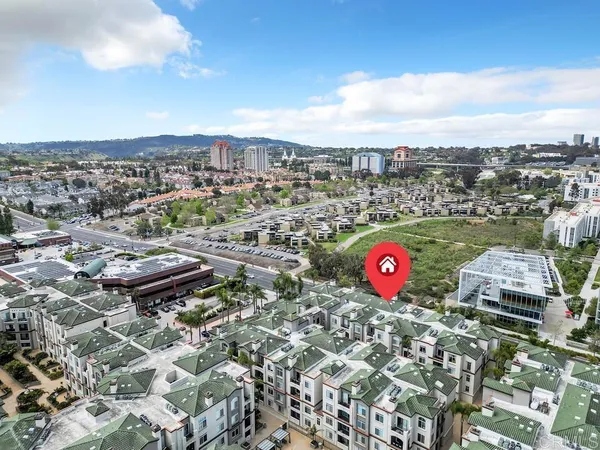 an aerial view of a houses with yard