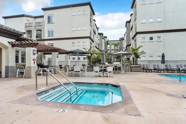a view of a swimming pool with sitting area