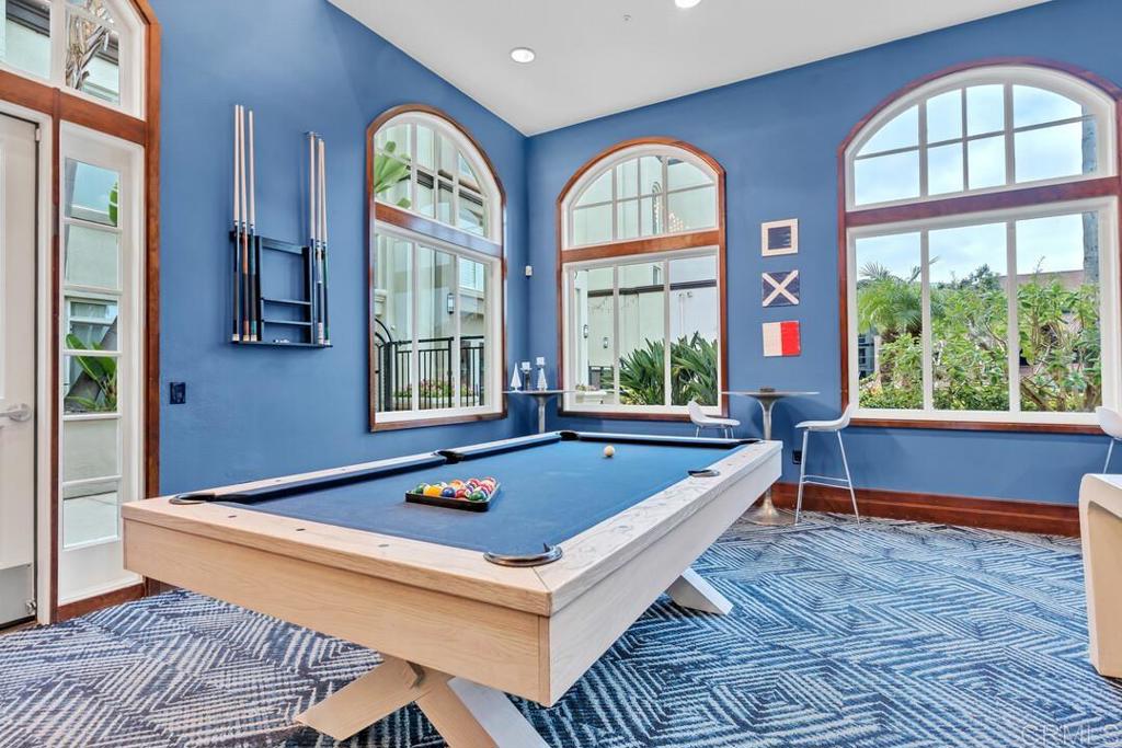 9253 Regents Road, Unit A203 San Diego, CA 92037 - Photo 29 of 38 a living room with furniture and a window