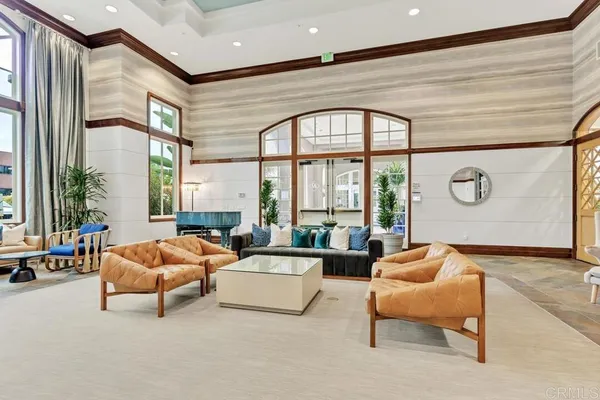 a living room with furniture and a large window