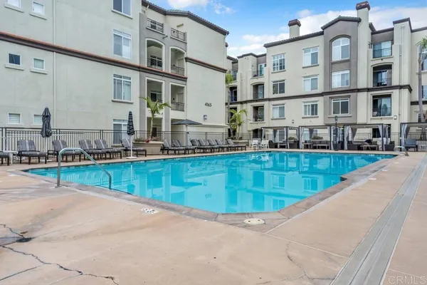 a view of a swimming pool with a lounge chairs