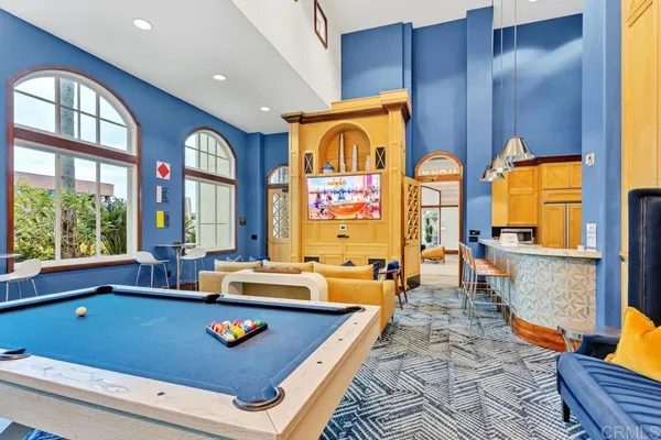 a room with lots of furniture and windows