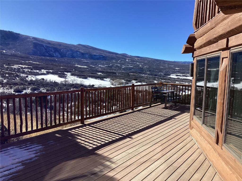 9073 54 7/10 Road Molina, CO 81646 - Photo 8 of 38 Snow covered deck with a mountain view