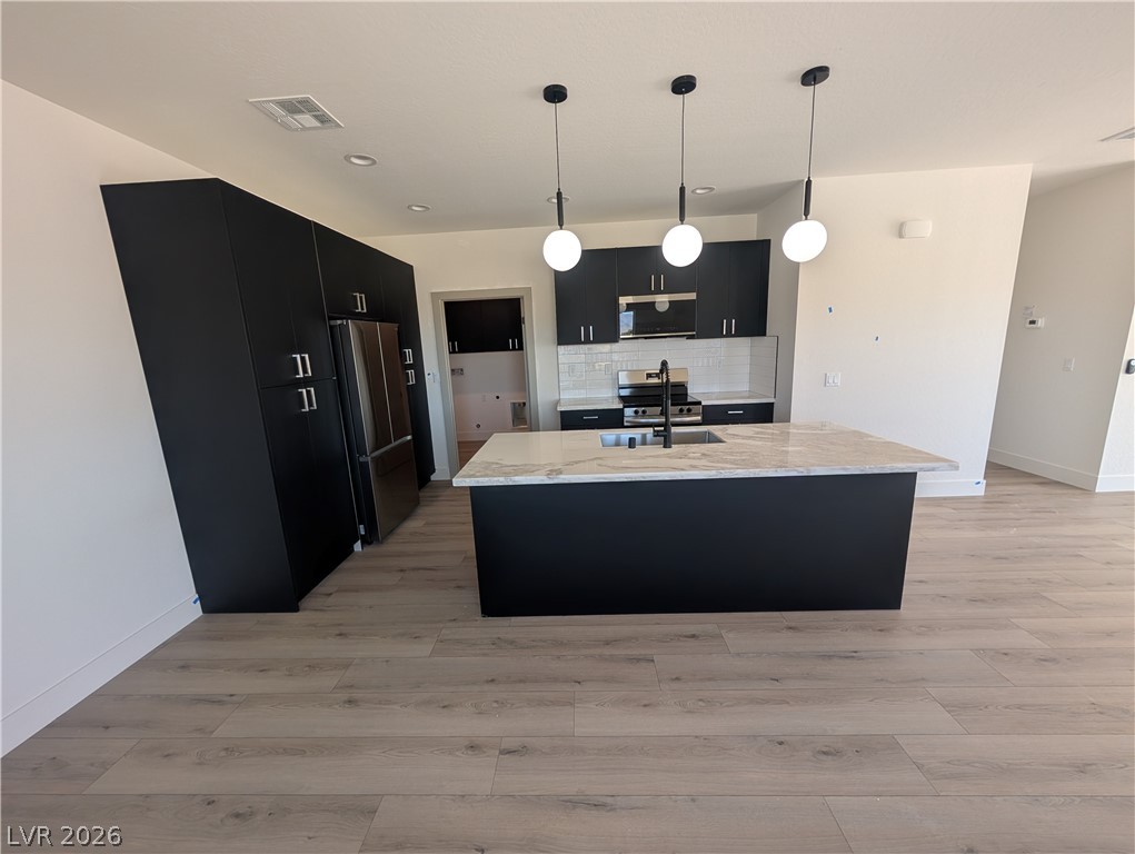 4670 Medicine Man Road Pahrump, NV 89048 - Photo 8 of 36 Culinary adventures await in this kitchen, boasting ample counter space and a central island.