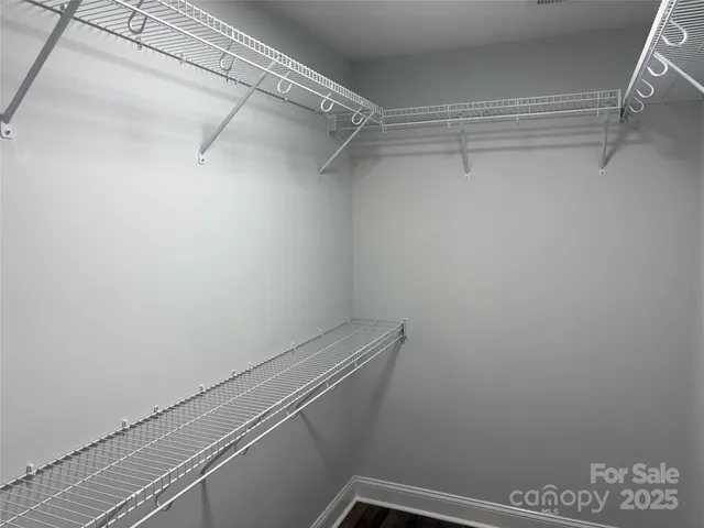 a view of a room with racks on the wall