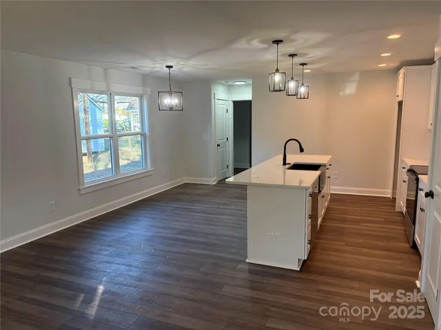 a room with wooden floor and window