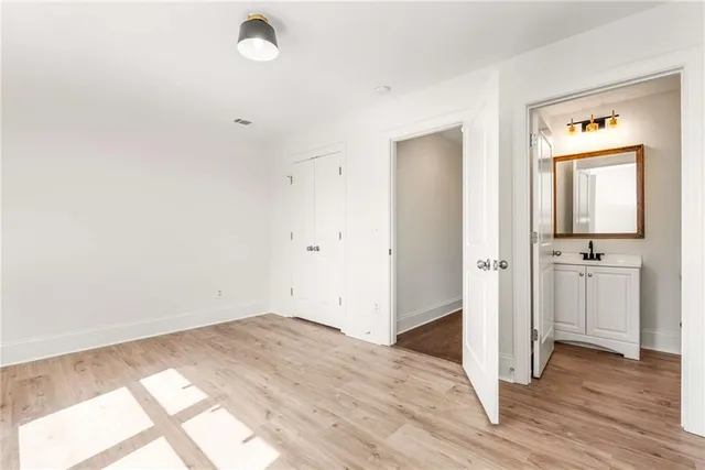 a view of a room with wooden floor