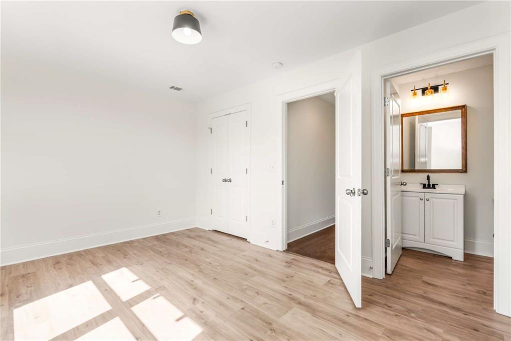 94 Lucy Street Southeast, Unit A Atlanta, GA 30312 - Photo 22 of 25 a view of a room with wooden floor