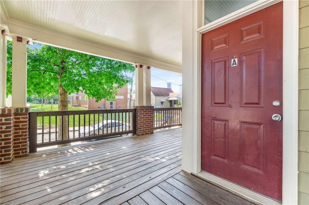 94 Lucy Street Southeast, Unit A Atlanta, GA 30312 - Photo 25 of 25 a view of a balcony with wooden floor