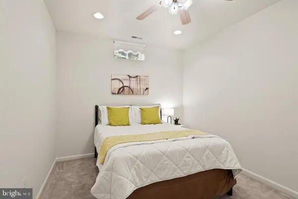 a bedroom with a bed and a table