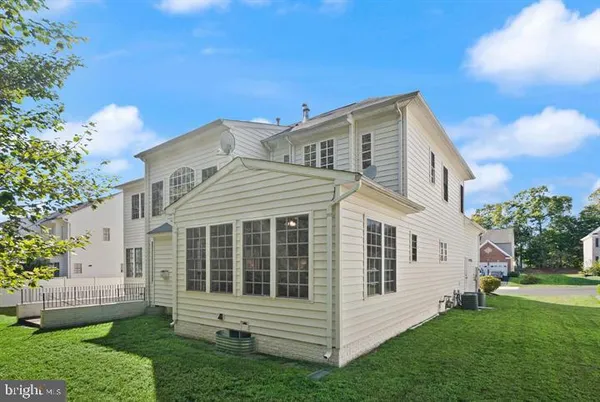 a view of house with yard