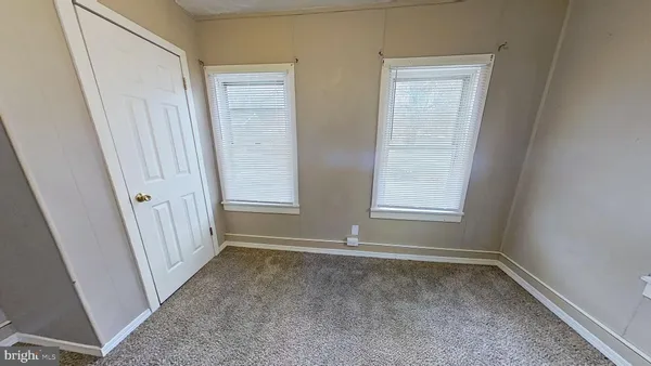 a view of room with window and stairs