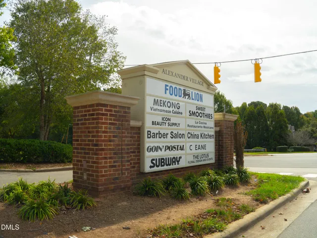 a view of a sign that is sitting in front of a building