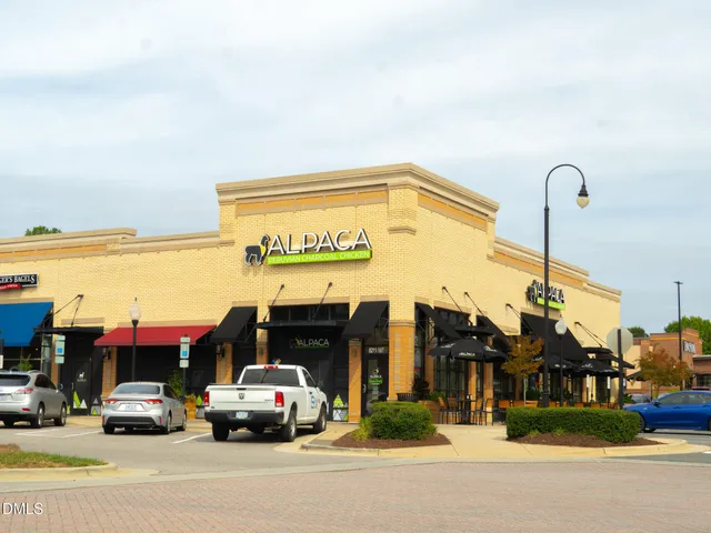 a view of street with parked cars