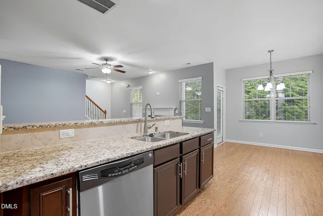 a bathroom with a granite countertop sink a large mirror and vanity