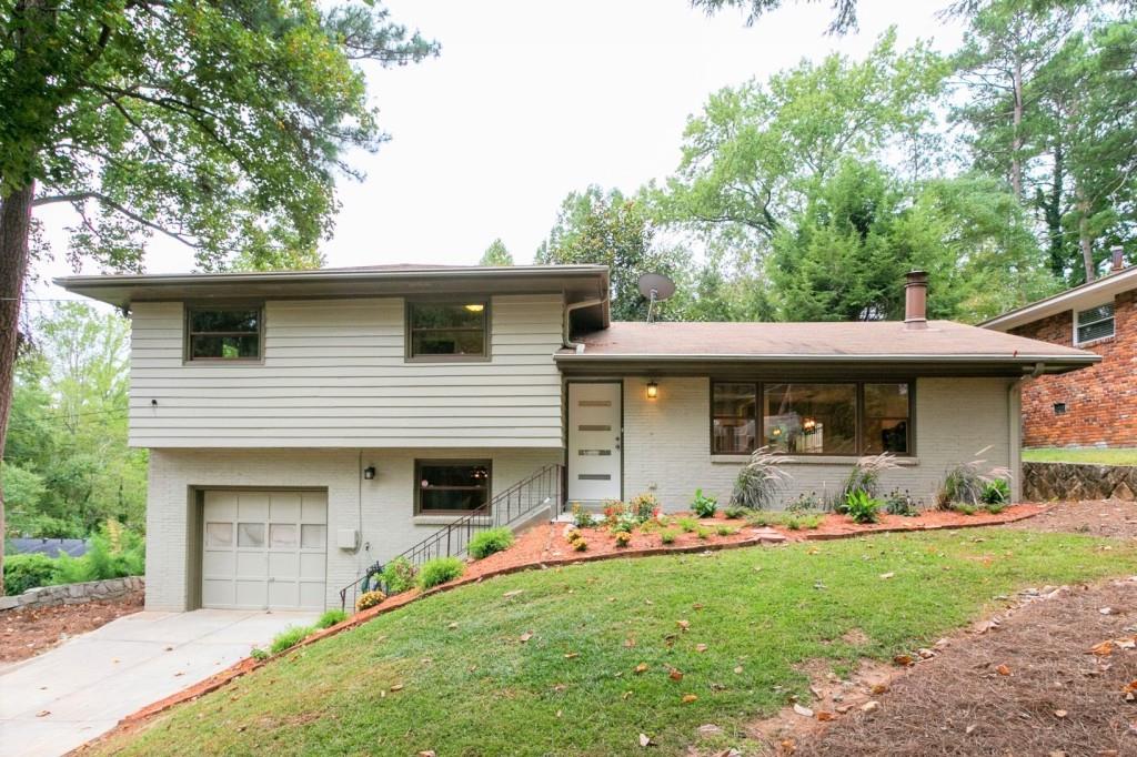 3147 Bobbie Lane Decatur, GA 30032 - Photo 1 of 1 a front view of a house with a yard and porch