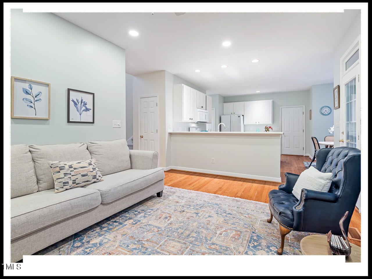 8214 Morrell Lane Durham, NC 27713 - Photo 11 of 48 a living room with furniture and a wooden floor