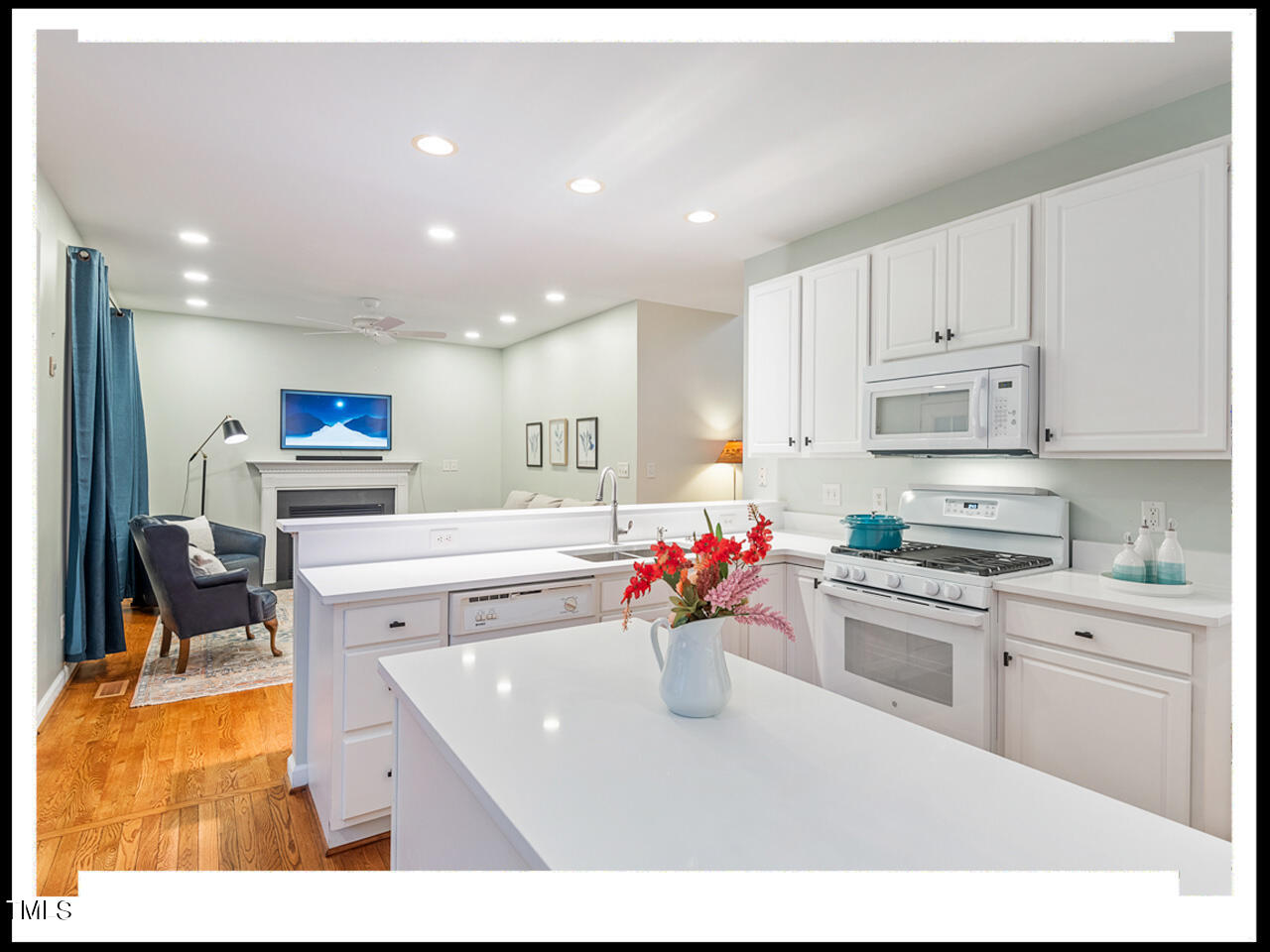 8214 Morrell Lane Durham, NC 27713 - Photo 13 of 48 a kitchen with stainless steel appliances kitchen island sink stove and cabinets