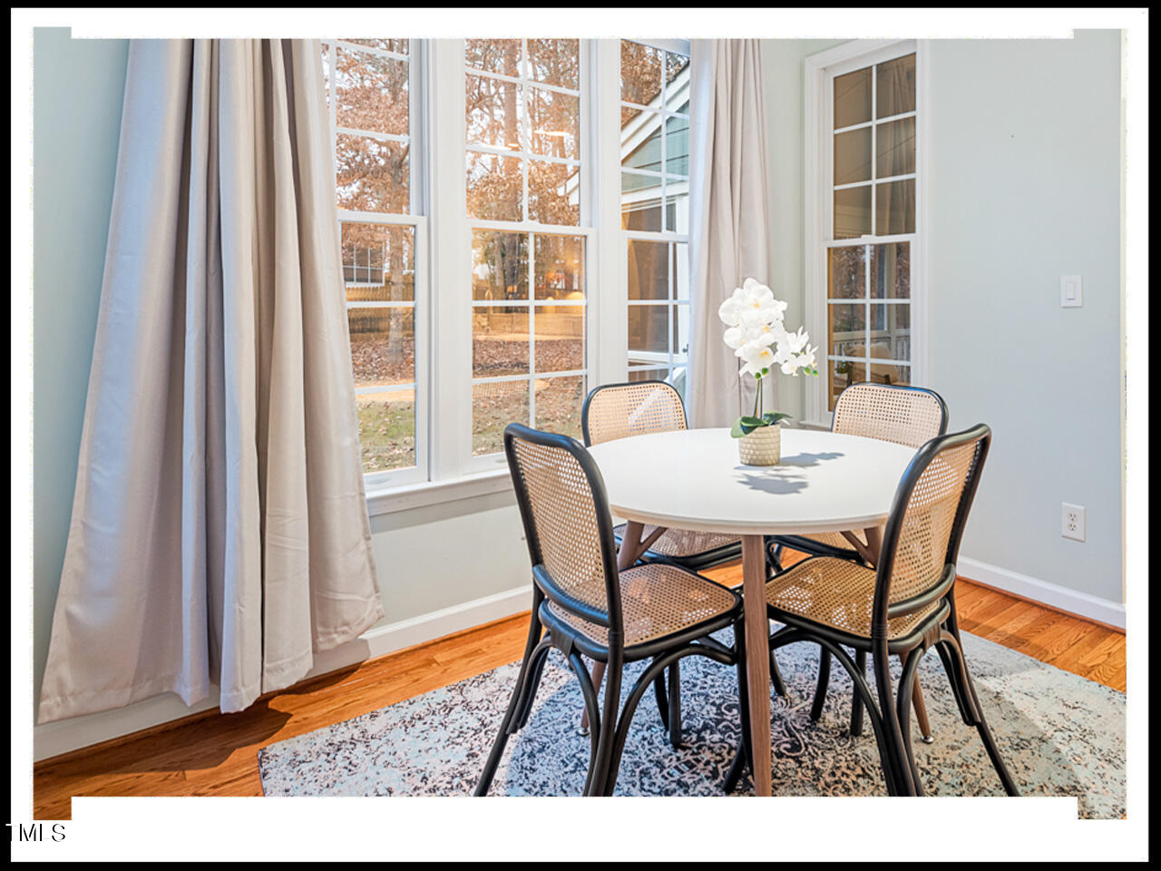 8214 Morrell Lane Durham, NC 27713 - Photo 17 of 48 a view of a dining room with furniture and wooden floor