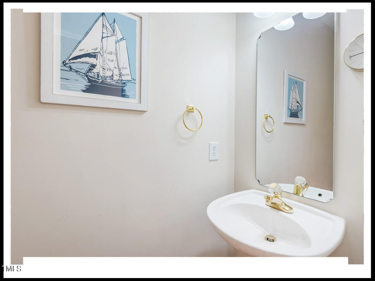 8214 Morrell Lane Durham, NC 27713 - Photo 21 of 48 a bathroom with a sink and mirror