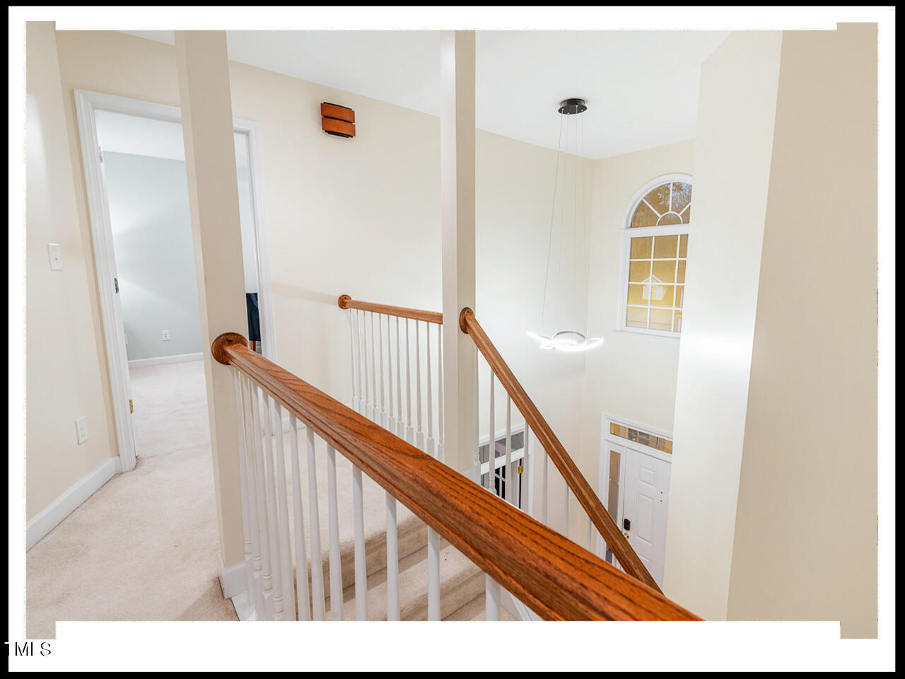 8214 Morrell Lane Durham, NC 27713 - Photo 23 of 48 a view of a hallway with staircase