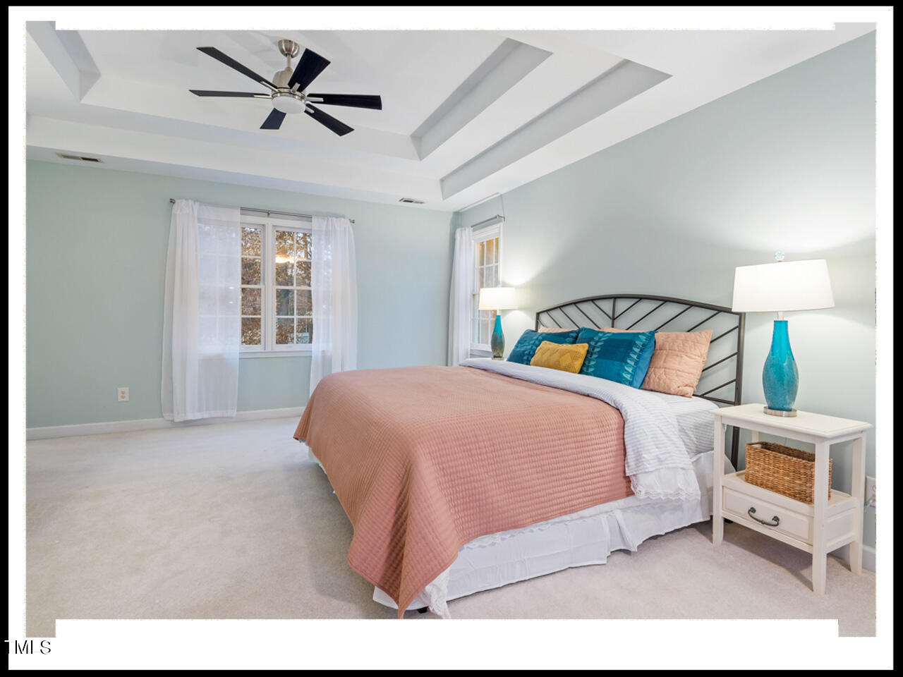 8214 Morrell Lane Durham, NC 27713 - Photo 24 of 48 a bedroom with a bed and a tv