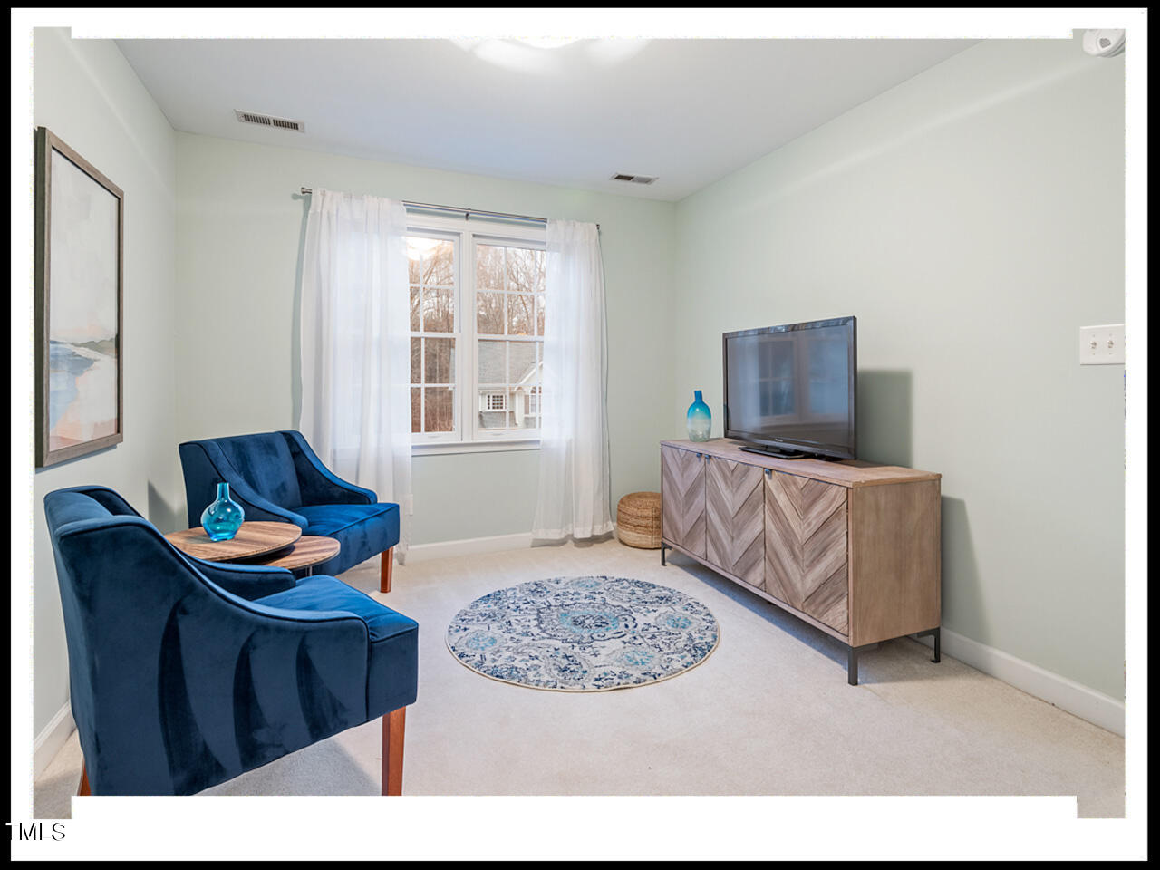 8214 Morrell Lane Durham, NC 27713 - Photo 25 of 48 a living room with furniture and a flat screen tv