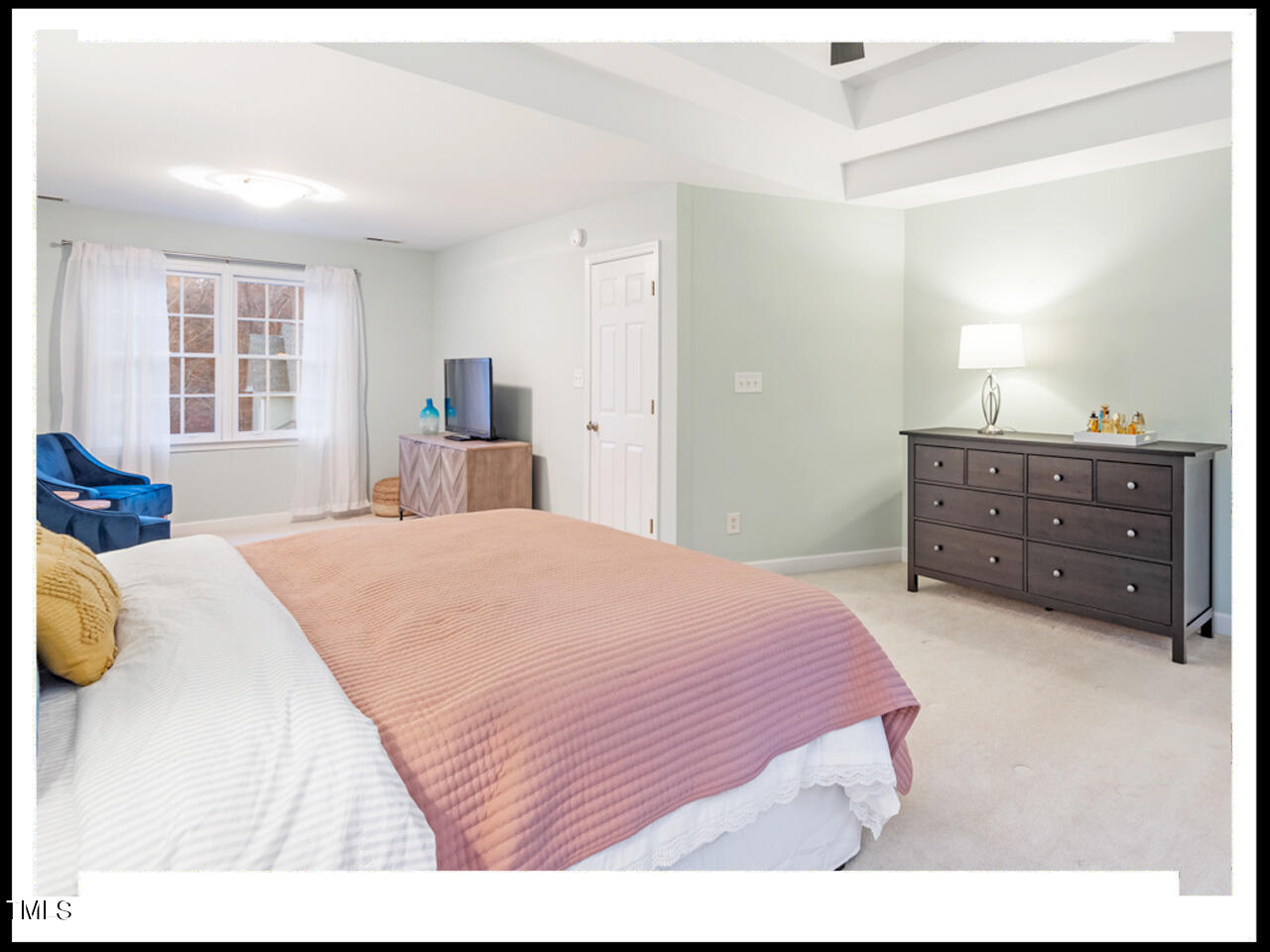 8214 Morrell Lane Durham, NC 27713 - Photo 28 of 48 a bedroom with a bed and wooden floor