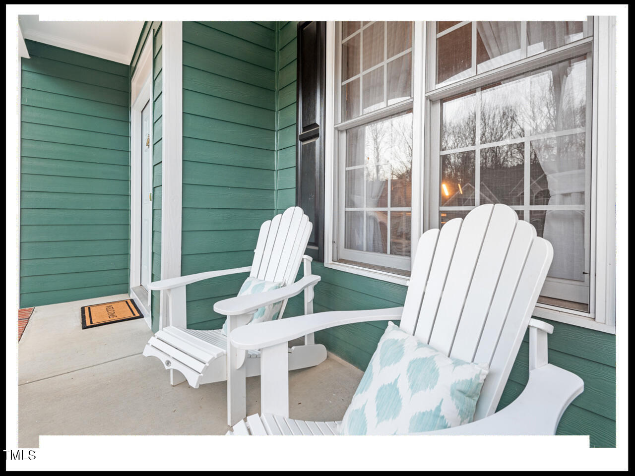8214 Morrell Lane Durham, NC 27713 - Photo 3 of 48 a view of a living room and a porch with furniture