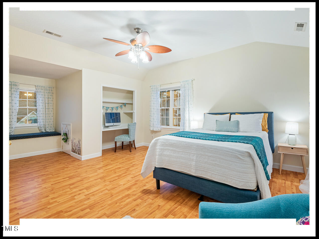 8214 Morrell Lane Durham, NC 27713 - Photo 35 of 48 a bedroom with a bed and a chandelier