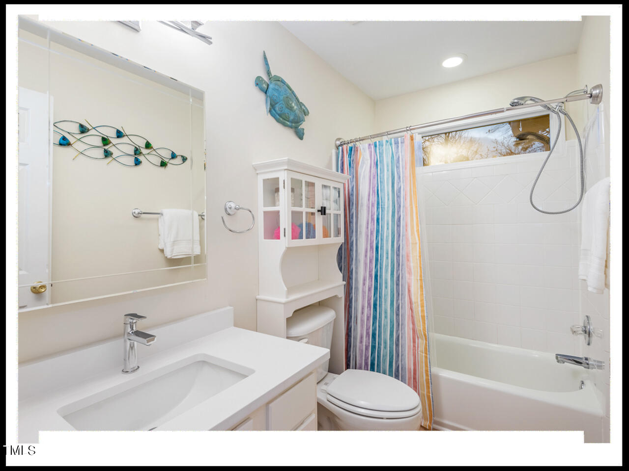 8214 Morrell Lane Durham, NC 27713 - Photo 39 of 48 a bathroom with a sink a toilet and a bathtub