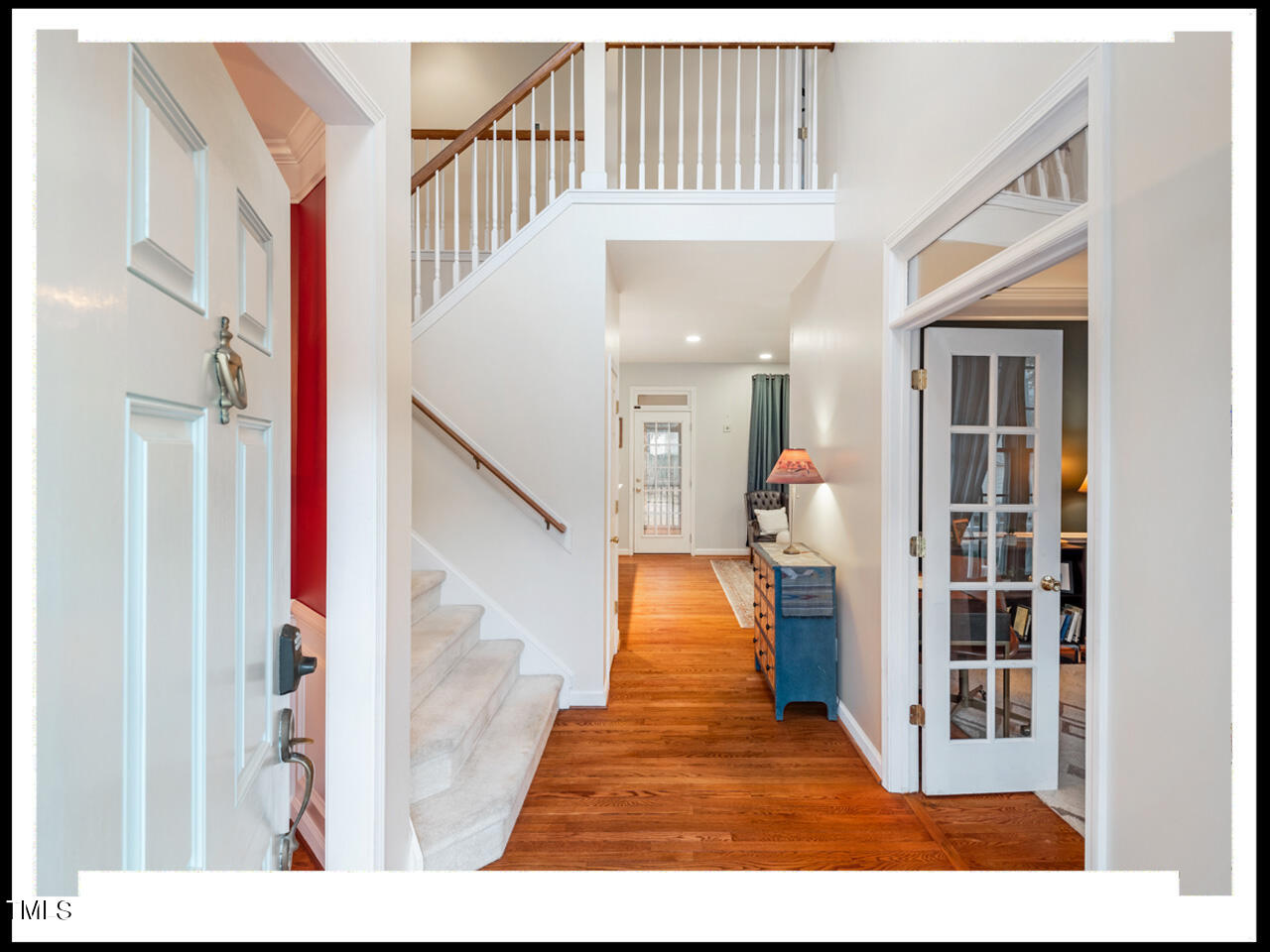 8214 Morrell Lane Durham, NC 27713 - Photo 4 of 48 a view of entryway and hall with wooden floor