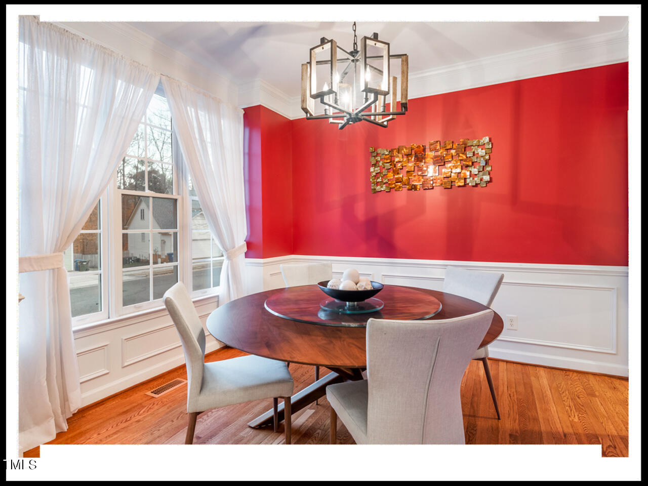 8214 Morrell Lane Durham, NC 27713 - Photo 5 of 48 a view of a dining room with furniture a chandelier and wooden floor