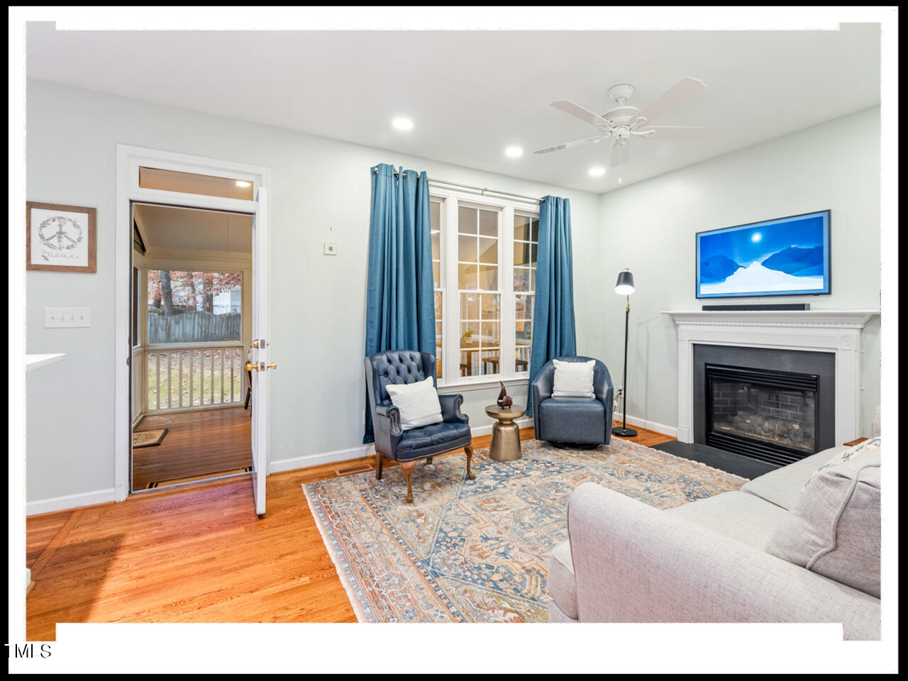8214 Morrell Lane Durham, NC 27713 - Photo 8 of 48 a living room with furniture and a fireplace