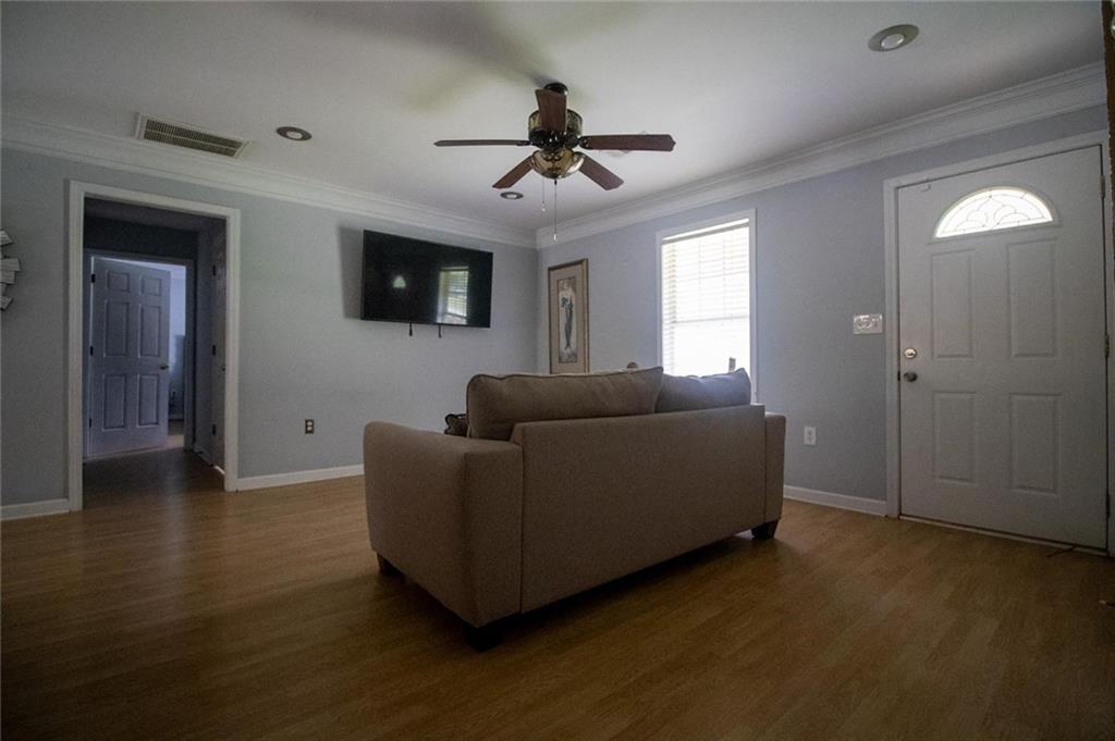 4184 Red Laurel Way Southwest Snellville, GA 30039 - Photo 12 of 35 a living room with furniture and a flat screen tv