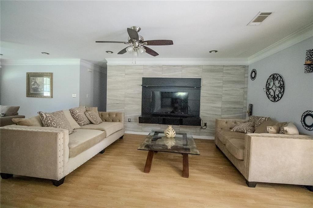 4184 Red Laurel Way Southwest Snellville, GA 30039 - Photo 16 of 35 a living room with furniture and a fireplace
