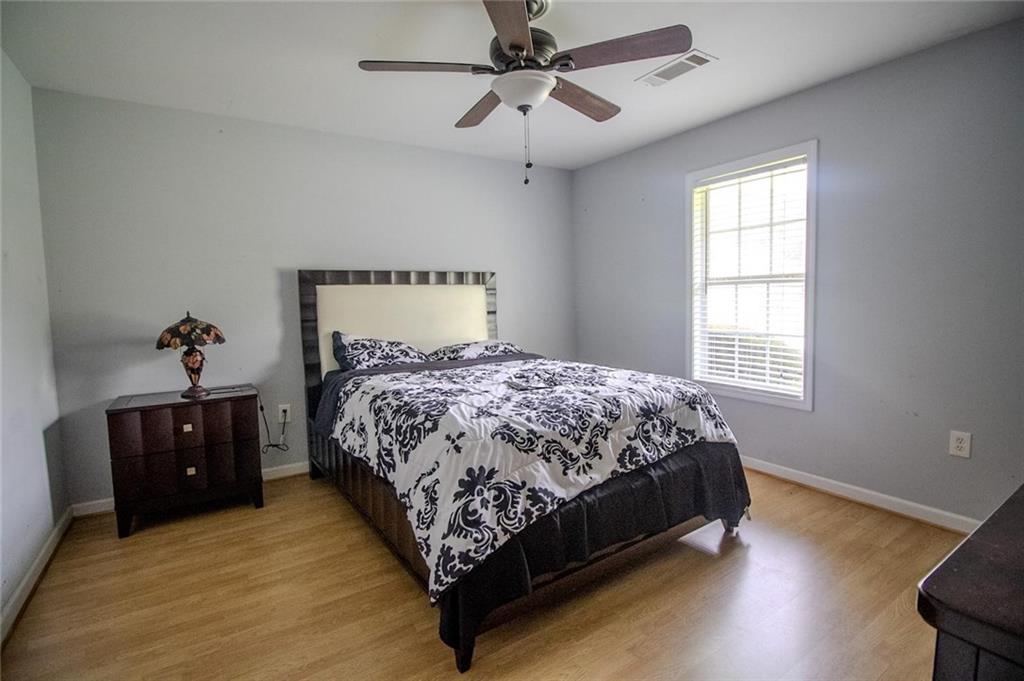 4184 Red Laurel Way Southwest Snellville, GA 30039 - Photo 24 of 35 a bedroom with a bed and a window