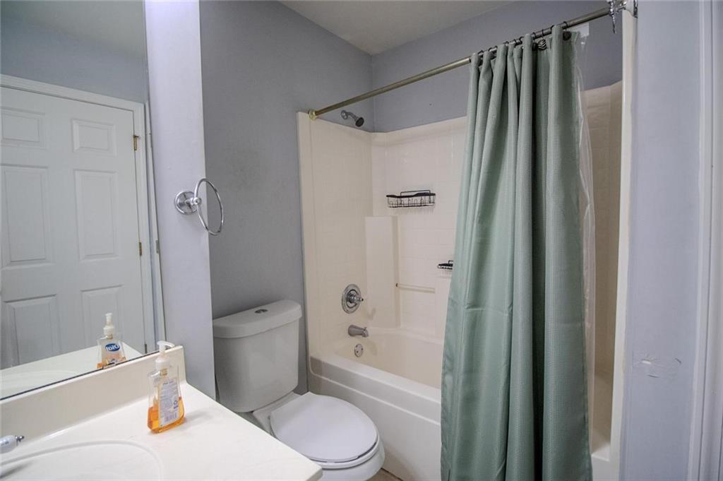 4184 Red Laurel Way Southwest Snellville, GA 30039 - Photo 25 of 35 a bathroom with a sink toilet and shower