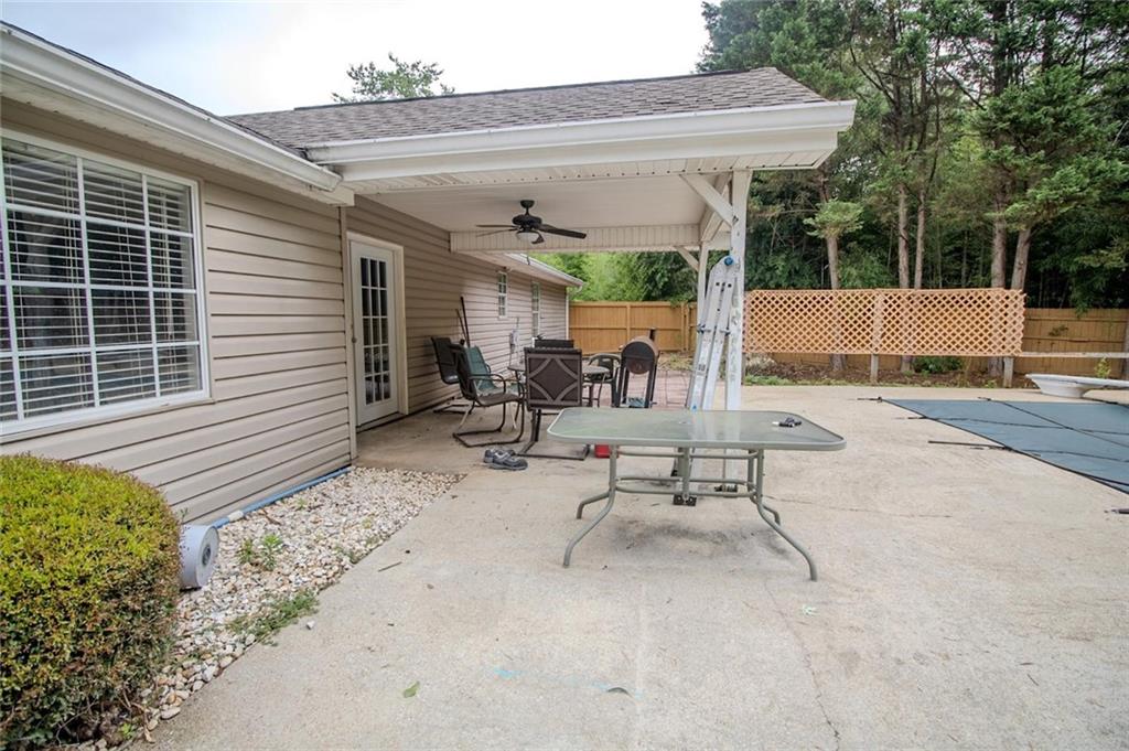 4184 Red Laurel Way Southwest Snellville, GA 30039 - Photo 30 of 35 a view of a patio with a table and chairs and potted plants