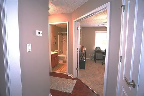 a view of a bathroom from a hallway