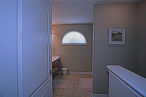 a bathroom with a toilet and a window